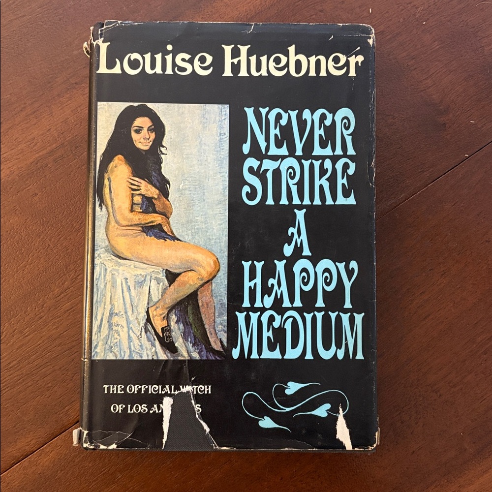 Never Strike a Happy Medium Book